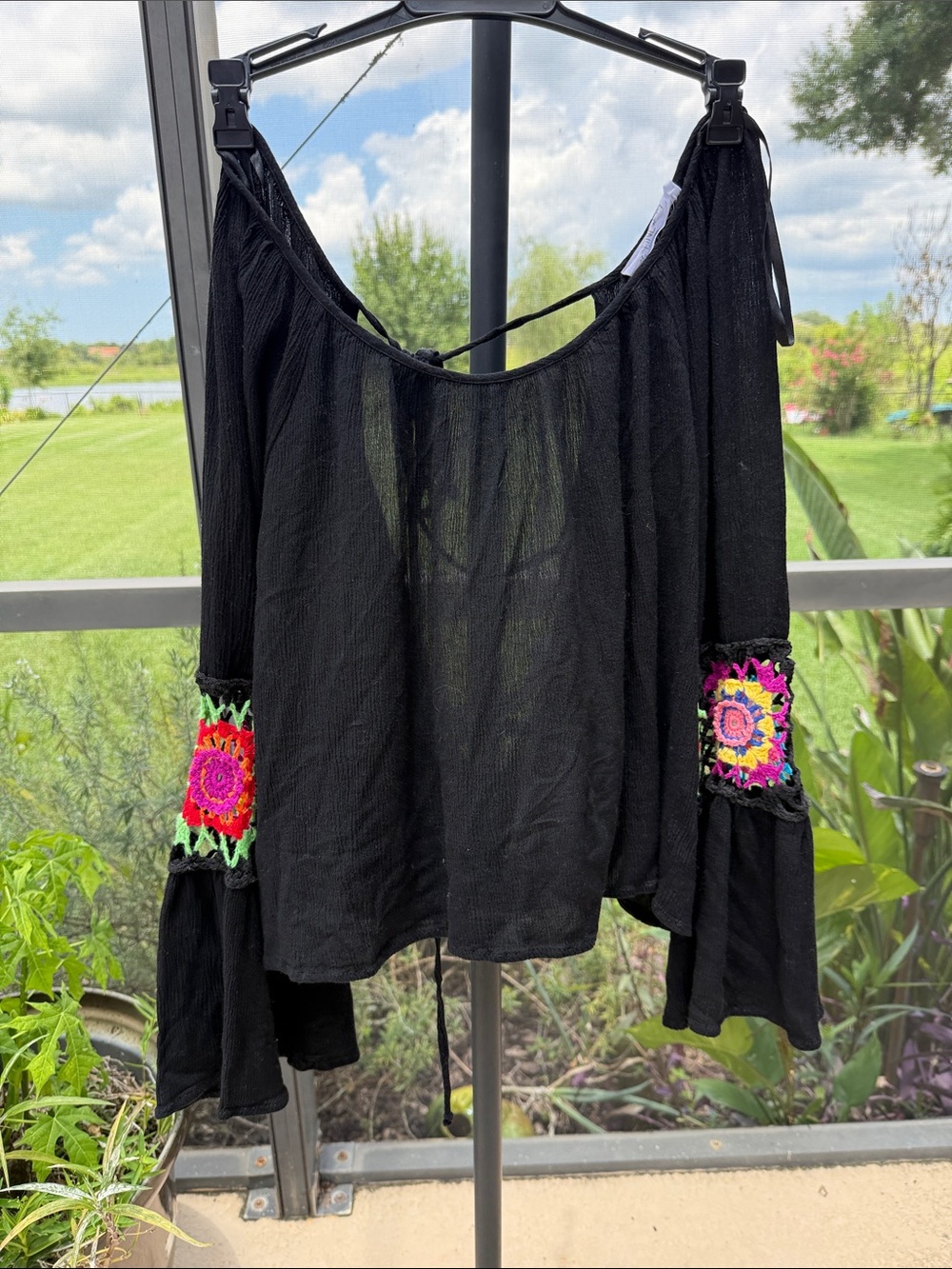 Black Off-Shoulder Blouse with Colorful Crochet Sleeve Panels open tie back
